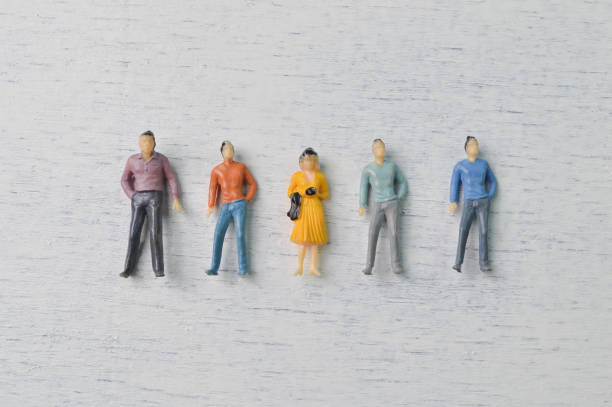 istock People figures standing together isolated on a white background 1365050559