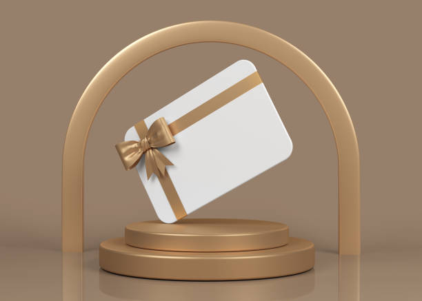 White-colored greeting card with gold-colored tied ribbon on a stand. stock photo