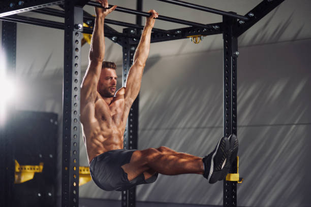 istock Young Man Doing L-Sit Exercise outdoors 1365067995