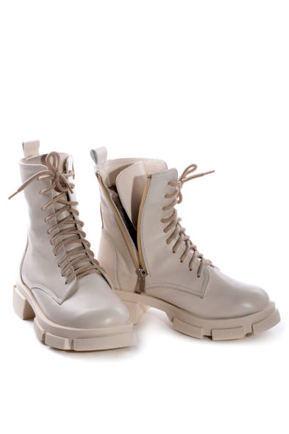 istock Female winter boots on high soles on a white background 1365068591