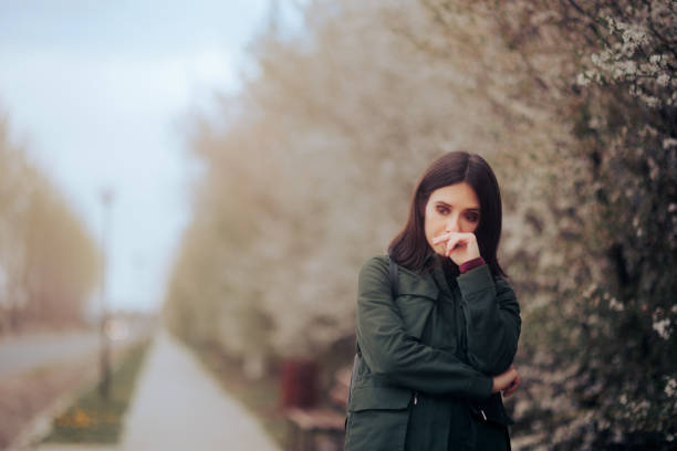 Unhappy Woman Suffering from Seasonal Affective Disorder Sad person feeling unwell and stressed from seasonal allergies seasonal affective disorder stock pictures, royalty-free photos & images