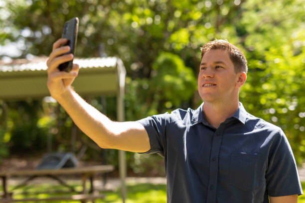 istock Man making a video call on his mobile phone 1365071529