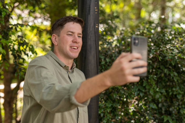 istock Man making a video call on his mobile phone 1365071546