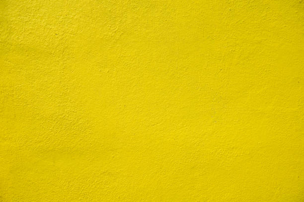 istock A yellow rough concrete wall in exterior, house concept 1365076537
