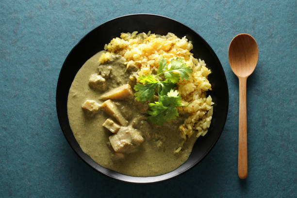 istock Coconut flavored Thai curry and coriander leaves 1365078731