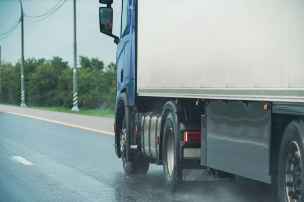 istock Truck drives in the rain 1365078947