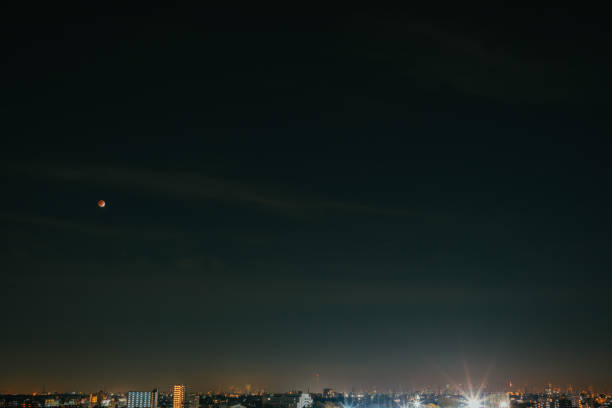 istock Night sky with lunar eclipse from Tokyo in early winter, November 2021 1365084107