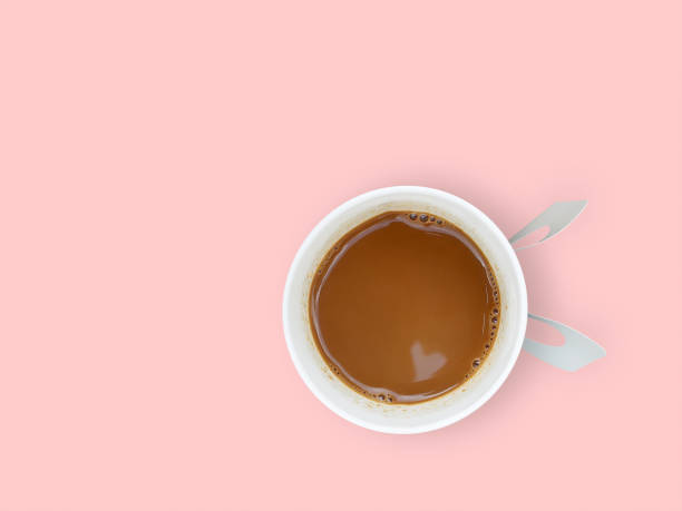 istock mini heart reflection on coffee surface in white paper cup isolated on pastel pink background 1365085454