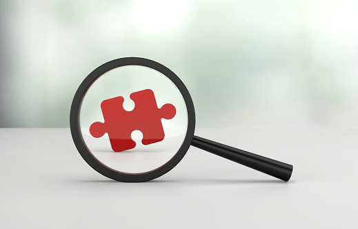 Magnifying glass and success Puzzle piece icon. Business and research concept.