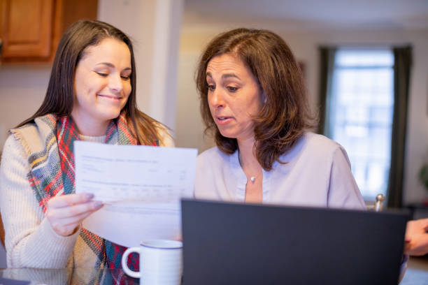 istock Daughter surprising her monther with university grades 1365086752