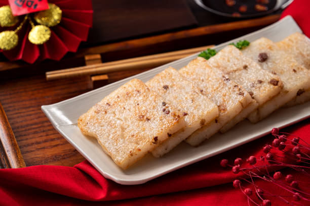 Delicious Chinese radish cake for lunar new year celebration cuisine. Close up of delicious Chinese radish cake for lunar new year celebration cuisine. cantonese cuisine stock pictures, royalty-free photos & images