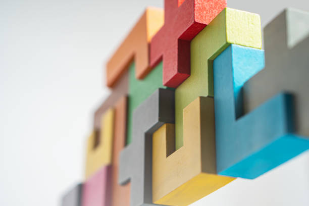 istock Abstract construction from wooden blocks. The concept of logical thinking. 1365088779