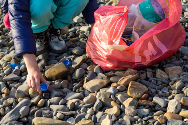 istock A child helps collect plastic garbage. Ecology and care for nature 1365089107