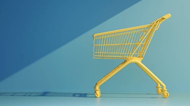 istock empty yellow supermarket trolley on blue background 1365089131