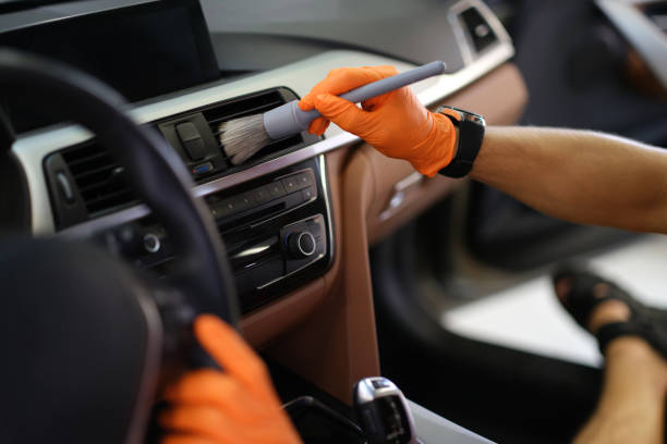 istock Hands brush dust from the ventilation system in the car 1365089160