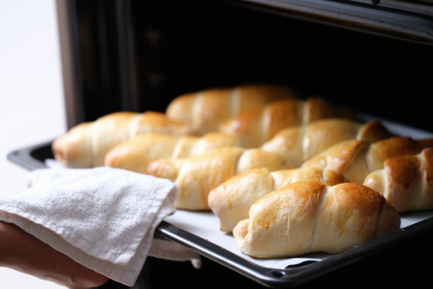 istock Open oven on a hot baking sheet, fresh baked goods 1365090486