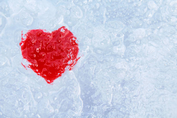 istock Frozen red heart in ice. Close-up. Background. Texture. 1365093457