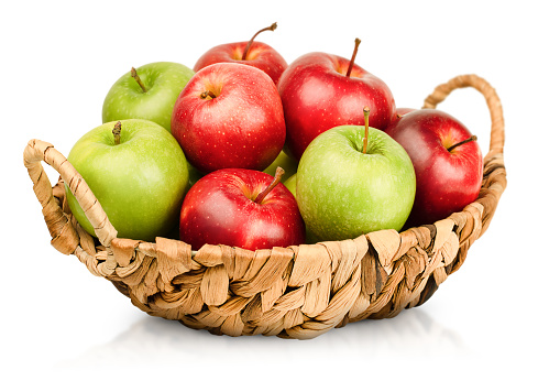 basket with apples on a white isolated background