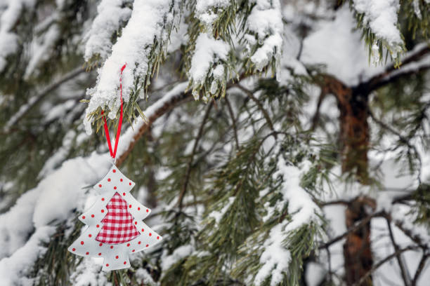 istock Christmas tree toy is hanging on a winter tree 1365100603