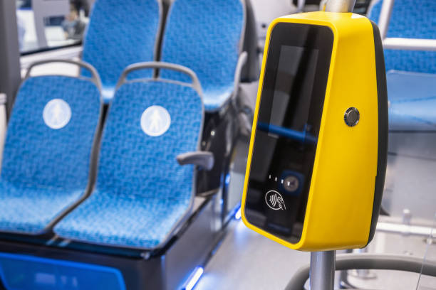 comfortable city bus, an electric bus or a hydrogen bus cabin with payment for travel via validator stock photo