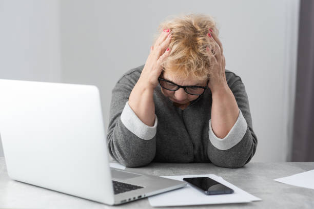 istock Pensioner read countless papers and is very focused 1365105249