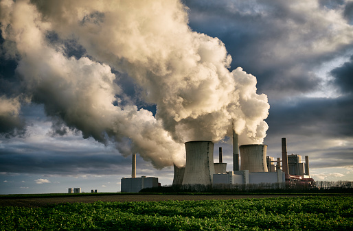 High resolution photograph of a brown-coal fired power plant with pollution, Germany.