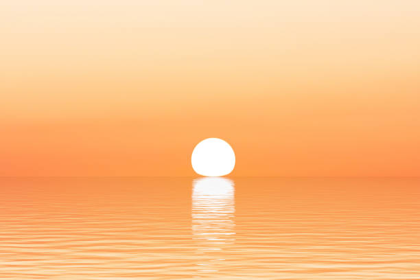 istock Sun on horizon over water surface with waves close-up 1365106422