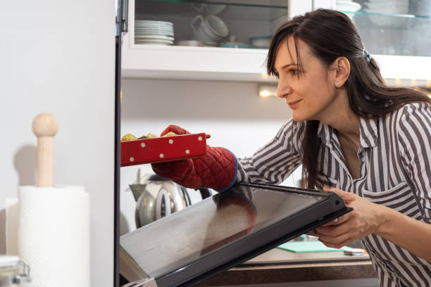 istock Young woman preparing food 1365106967