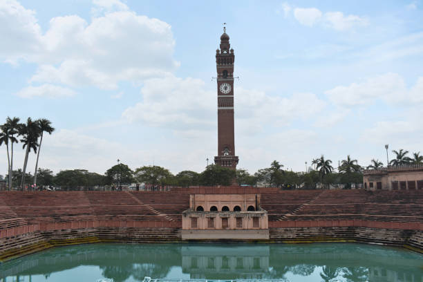 Husainabad Clock Tower - Ghanta Ghar and Talab - Pond with red stoned stairs constructed by Nawab Nasir-ud-din Haider in the year 1881. Lucknow, Uttar Pradesh stock photo