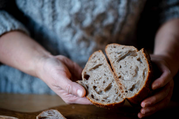 istock Baker Holds Cut-out Wholegrain Bread 1365111353