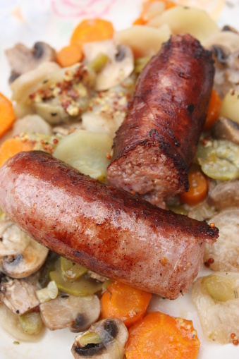 Diot sausages served with a stew of vegetables and mushrooms  Savoy sausages France
