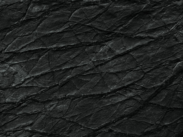 black rock texture with cracks and veins. close-up. dark rough stone surface background - root paper black textured imagens e fotografias de stock