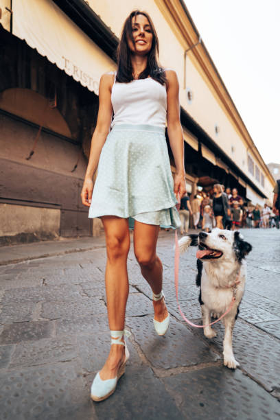 istock woman walking with her border collie in Ponte Vecchio - Florence 1365115579