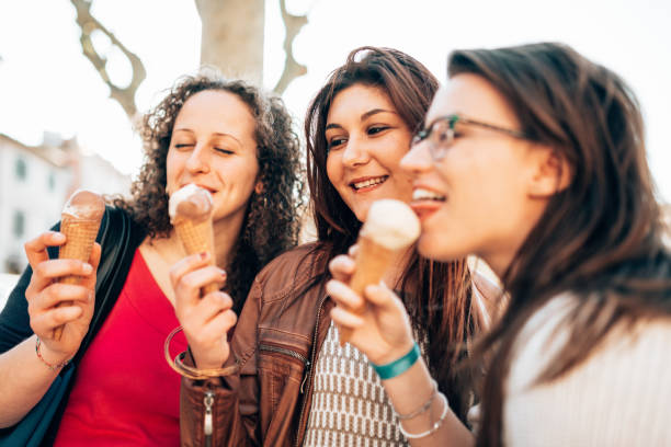 istock happiness friends licking the icecream 1365115823