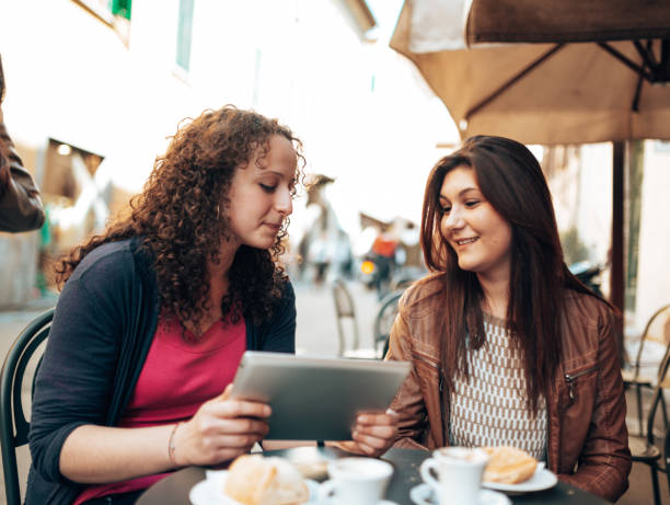 istock happiness friends at the cafe using the tablet 1365116801