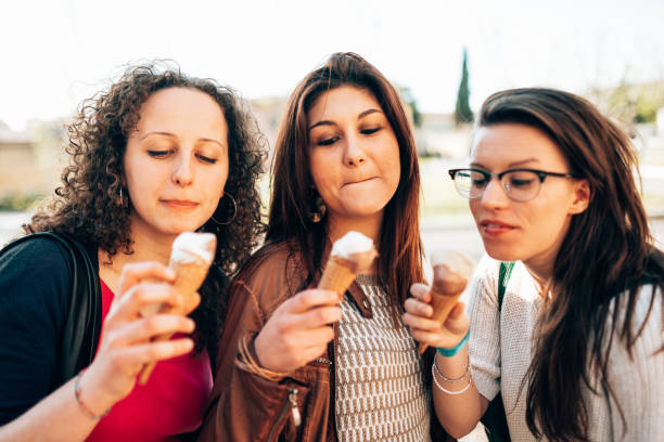 istock happiness friends licking the icecream 1365117150