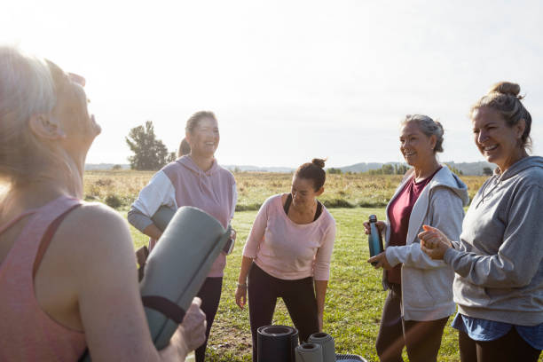 istock Friends Doing Yoga Outdoors 1365118255