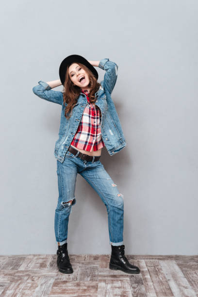 istock Smiling pretty woman in hat posing with mouth open 1365118405