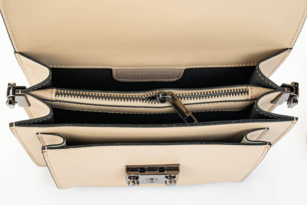 istock beige leather bag isolated on white background. minimalist purse ,handbag 1365118577