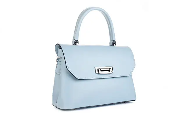 Photo of Blue fashion purse handbag on white background isolated