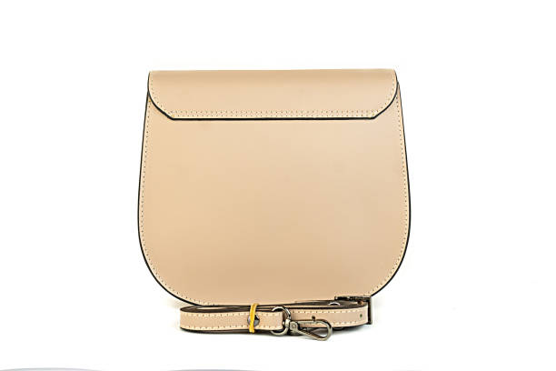 istock beige leather bag isolated on white background. minimalist purse ,handbag 1365118620
