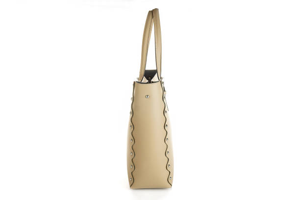 istock beige leather bag isolated on white background. minimalist purse ,handbag 1365118675