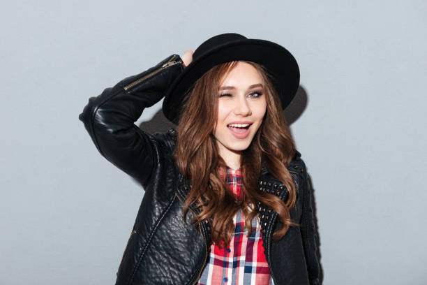 istock Happy young lady standing over grey background 1365118861