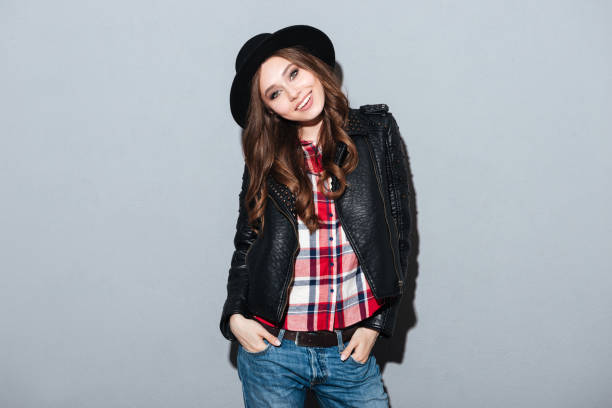 istock Happy young lady standing over grey background 1365120304
