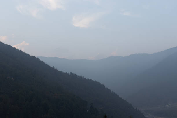 istock mountains shadow with hazy sky at morning from flat angle 1365120509