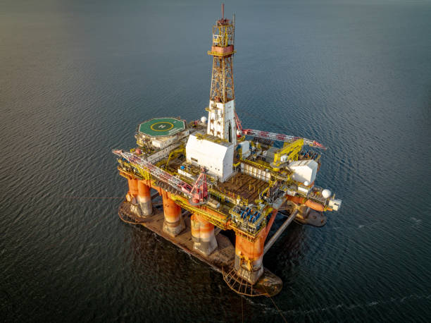 istock Oil and Gas Drilling Platform at Sunset 1365123951