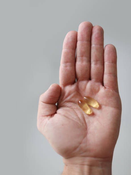 istock Picture of a hand holding pills. 1365125610
