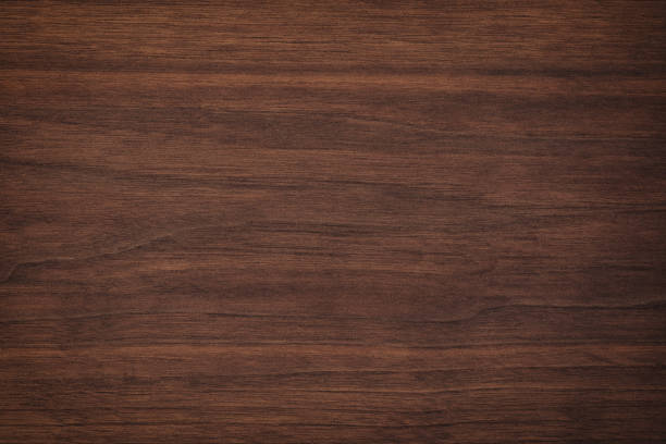 текстура дерева с естественным рисунком. темный деревянный фон, коричневая доска - walnut стоковые фото и изображения