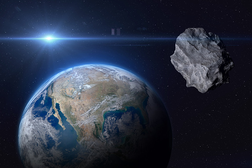 Planet Earth and big asteroid in the space. Concept a potentially hazardous object (PHO). Potentially hazardous asteroids (PHAs). Asteroid in outer space near Earth planet. Stony-iron meteorite is solar system. Elements of this image furnished by NASA. ______ Url(s): 