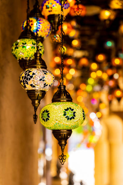 istock Traditional handmade multicolor Turkish, Moroccan, Arabian lamps hanging with nice blurred background. Mosaic style and colored glass lantern. Suitable for Ramadan Kareem greeting. 1365126081
